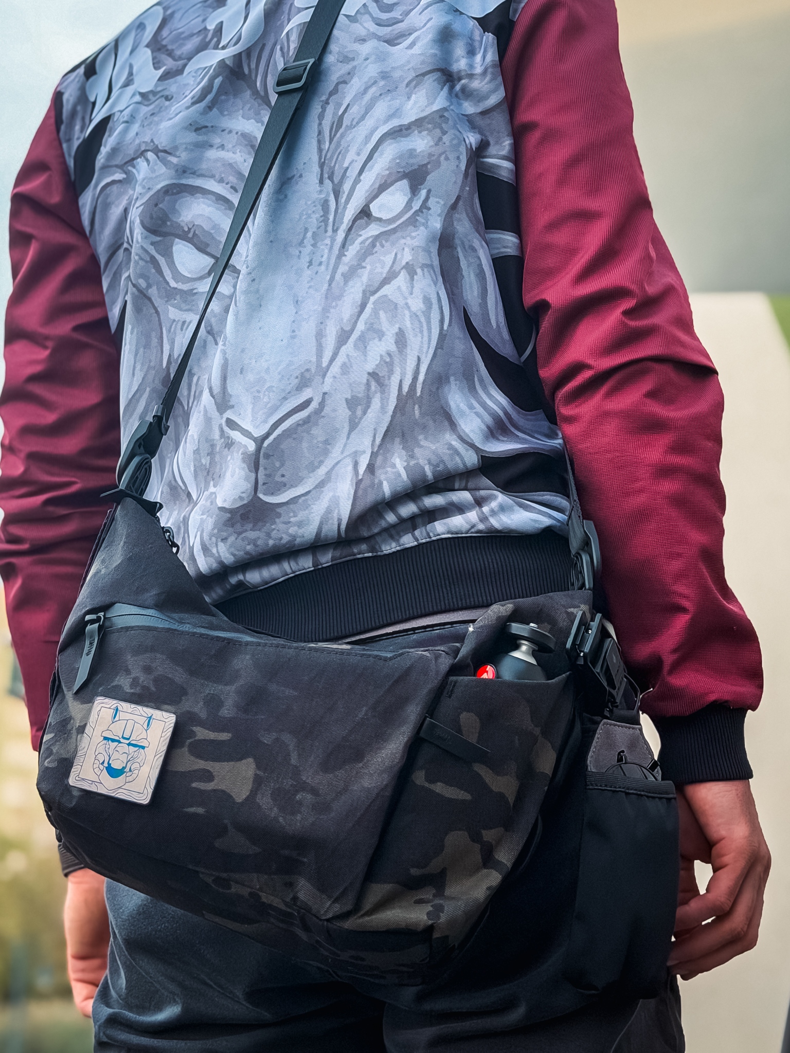 Flow Satchel worn across the body outdoors